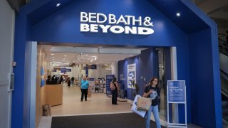 A person exits a Bed Bath & Beyond store in New York City, June 29, 2022.