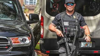 A member of the Secret Service is seen in front of the home of former President Donald Trump at Mar-A-Lago in Palm Beach, Florida on August 9, 2022.