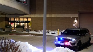 A police car sits parked outside Nordstrom at Mall of America after a shooting Friday, Dec. 23, 2022, in Bloomington, Minn. (AP Photo/Abbie Parr)