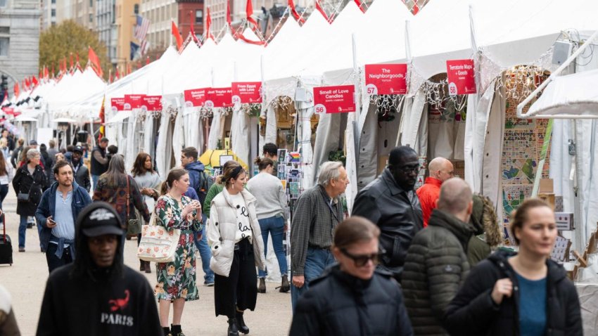 People shop for holiday and Christmas related gifts and items at the Annual Downtown Holiday Market in Washington, DC, December 8, 2022. (Photo by SAUL LOEB / AFP) (Photo by SAUL LOEB/AFP via Getty Images)