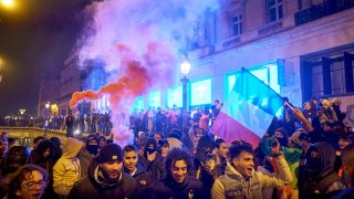 French football fans congregate on the Champs-Elysees in Paris following the team’s World Cup semifinal win.