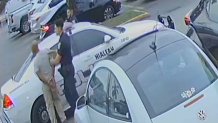 Surveillance video released by the Miami-Dade State Attorney's Office shows Hialeah Police officers Rafael Otano and Lorenzo Orfila taking Jose Oretga-Gutierrez into custody.