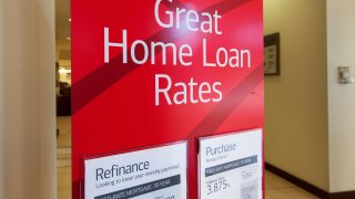 A sign advertising home loan rates for purchase or refinancing at a Bank of America in New York.