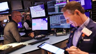 Traders work on the floor of the New York Stock Exchange during morning trading on January 04, 2023 in New York City.