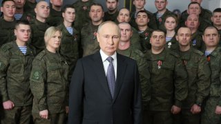 Russian President Vladimir Putin poses as he delivers a New Year’s address to the nation at the headquarters of the Southern Military District in Rostov-on-Don on December 31, 2022.