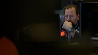 Traders work on the floor of the New York Stock Exchange during opening bell in New York City on January 18, 2023.
