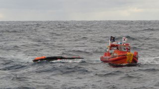 In this photo provided by the Korea Coast Guard, a South Korea coast guard vessel conducts a search operation