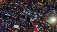 In this aerial view members of social movements protest in defense of democracy in Rio de Janeiro, Brazil, on January 9, 2023, a day after supporters of Brazil's far-right ex-president Jair Bolsonaro invaded the Congress, presidential palace, and Supreme Court in Brasilia. - Brazilian security forces locked down the area around Congress, the presidential palace and the Supreme Court Monday, a day after supporters of ex-president Jair Bolsonaro stormed the seat of power in riots that triggered an international outcry. Hardline Bolsonaro supporters have been protesting outside army bases calling for a military intervention to stop Lula from taking power since his election win. (Photo by Tercio TEIXEIRA / AFP) (Photo by TERCIO TEIXEIRA/AFP via Getty Images)