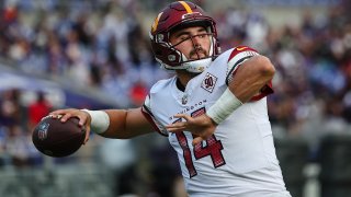 BALTIMORE, MD – AUGUST 27: Sam Howell #14 of the Washington Commanders warms up before the preseason game against the Baltimore Ravens at M&T Bank Stadium on August 27, 2022 in Baltimore, Maryland.