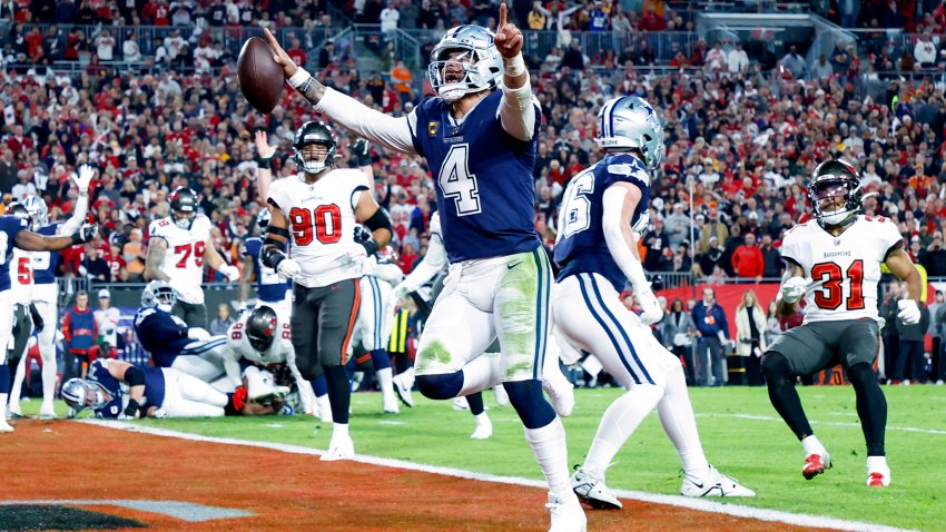 TAMPA, FLORIDA – JANUARY 16: Dak Prescott #4 of the Dallas Cowboys rushes for a touchdown against the Tampa Bay Buccaneers during the second quarter in the NFC Wild Card playoff game at Raymond James Stadium on January 16, 2023 in Tampa, Florida.