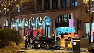 Six people were hurt – one of them critically – when two cars crashed and one of them collided with the National Housing Center building in Northwest D.C. on Sunday.