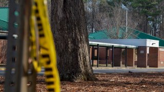 NEWPORT NEWS, VA – JANUARY 07: Police tape hangs from a sign post outside Richneck Elementary School following a shooting on January 7, 2023 in Newport News, Virginia. A 6-year-old student was taken into custody after reportedly shooting a teacher during an altercation in a classroom at Richneck Elementary School on Friday. The teacher, a woman in her 30s, suffered “life-threatening” injuries and remains in critical condition, according to police reports. (Photo by Jay Paul/Getty Images)