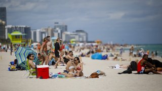 People gather on a beach in Miami, Florida, U.S., on Saturday, March 5, 2021.
