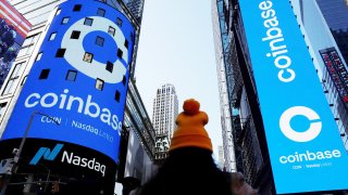The logo for Coinbase Global Inc, the biggest U.S. cryptocurrency exchange, is displayed on the Nasdaq MarketSite jumbotron and others at Times Square in New York, U.S., April 14, 2021.