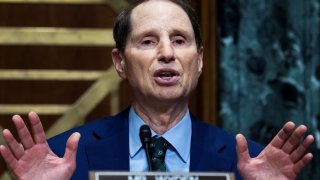 Senate Finance Committee Chairman Ron Wyden, D-Ore., questions IRS Commissioner Charles Rettig at a Senate Finance Committee hearing.