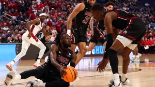 New Mexico State Aggies men’s basketball team passes the ball against the Arkansas Razorbacks during the second round of the 2022 NCAA Men’s Basketball Tournament held at the KeyBank Center on March 19, 2022 in Buffalo, New York. The team’s 2022-23 season has been officially canceled following an investigation that revealed sexual assault and harassment.