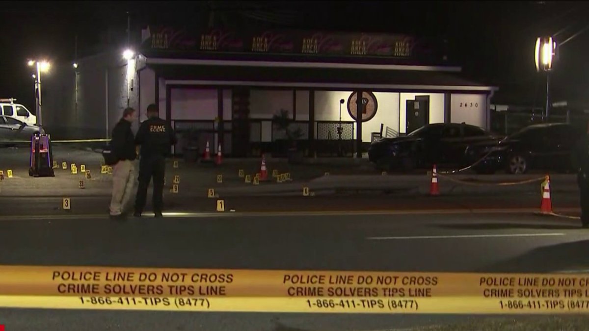 Two security guards hurt after man opens fire with a rifle outside strip  club