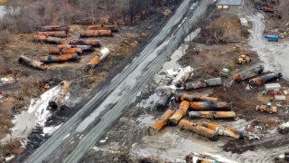 This photo taken with a drone shows the continuing cleanup of portions of a Norfolk Southern freight train that derailed in East Palestine, Ohio, Thursday, Feb. 9, 2023.