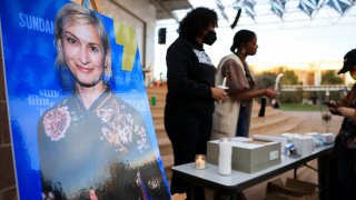 An image of cinematographer Halyna Hutchins, who died after being shot by Alec Baldwin on the set of his movie “Rust”, is displayed at a vigil in her honour in Albuquerque, New Mexico, October 23, 2021.