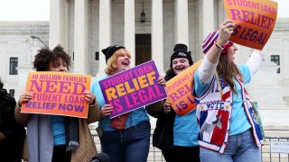 Student loan borrowers gather at Supreme Court the evening before the court hears two cases on student loan relief to state the relief is legal and needs to happen immediately on Feb. 27, 2023 in Washington, D.C.