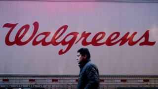 A man walks near a Walgreens pharmacy on March 09, 2023 in New York City.