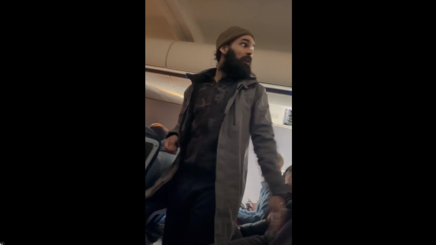 Francisco Severo Torres, seen on a plane from Los Angeles to Boston where he allegedly tried to open an emergency exit and later stab a flight attendant.