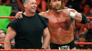 World Wrestling Entertainment Inc. Chairman Vince McMahon (L) and wrestler Triple H appear in the ring during the WWE Monday Night Raw show at the Thomas & Mack Center August 24, 2009