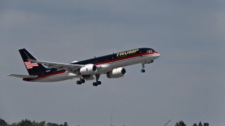 The plane of former US president Donald Trump takes off from Palm Beach International Airport in West Palm Beach, Florida, on April 3, 2023.