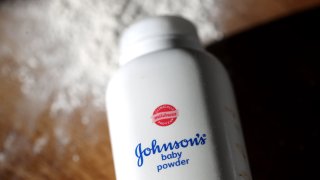 In this photo illustration a bottle of Johnson & Johnson baby powder is displayed on a table on November 12, 2021 in San Anselmo, California.