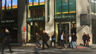 People walk in front of a First Republic Bank branch on March 20, 2023, in New York City.