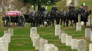 A caisson makes its way to a grave site in Arlington National Cemetery Dec. 10, 2001.