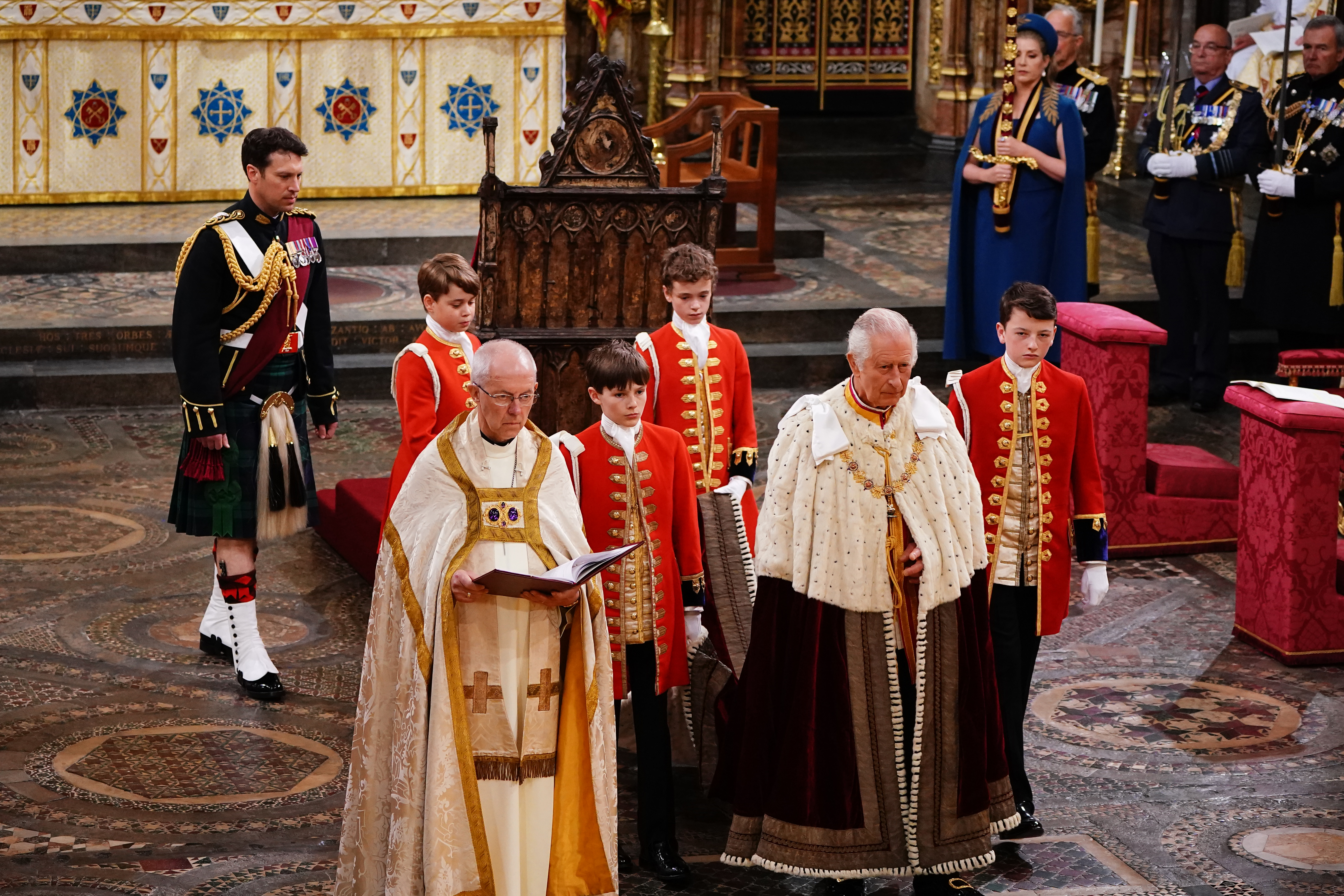 Prince George, left, with King Charles III during the Coronation of King Charles III and Queen Camilla on May 6, 2023 in London, England.