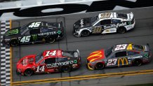 Chase Briscoe, driver of the No. 14 Mahindra Tractors Ford, Bubba Wallace, driver of the No. 23 McDonald's Toyota, Tyler Reddick, driver of the No. 45 Monster Energy Toyota, and Aric Almirola, driver of the No. 10 Smithfield Ford, race during the NASCAR Cup Series 65th Annual Daytona 500 at Daytona International Speedway on Feb. 19, 2023 in Daytona Beach, Fla. 