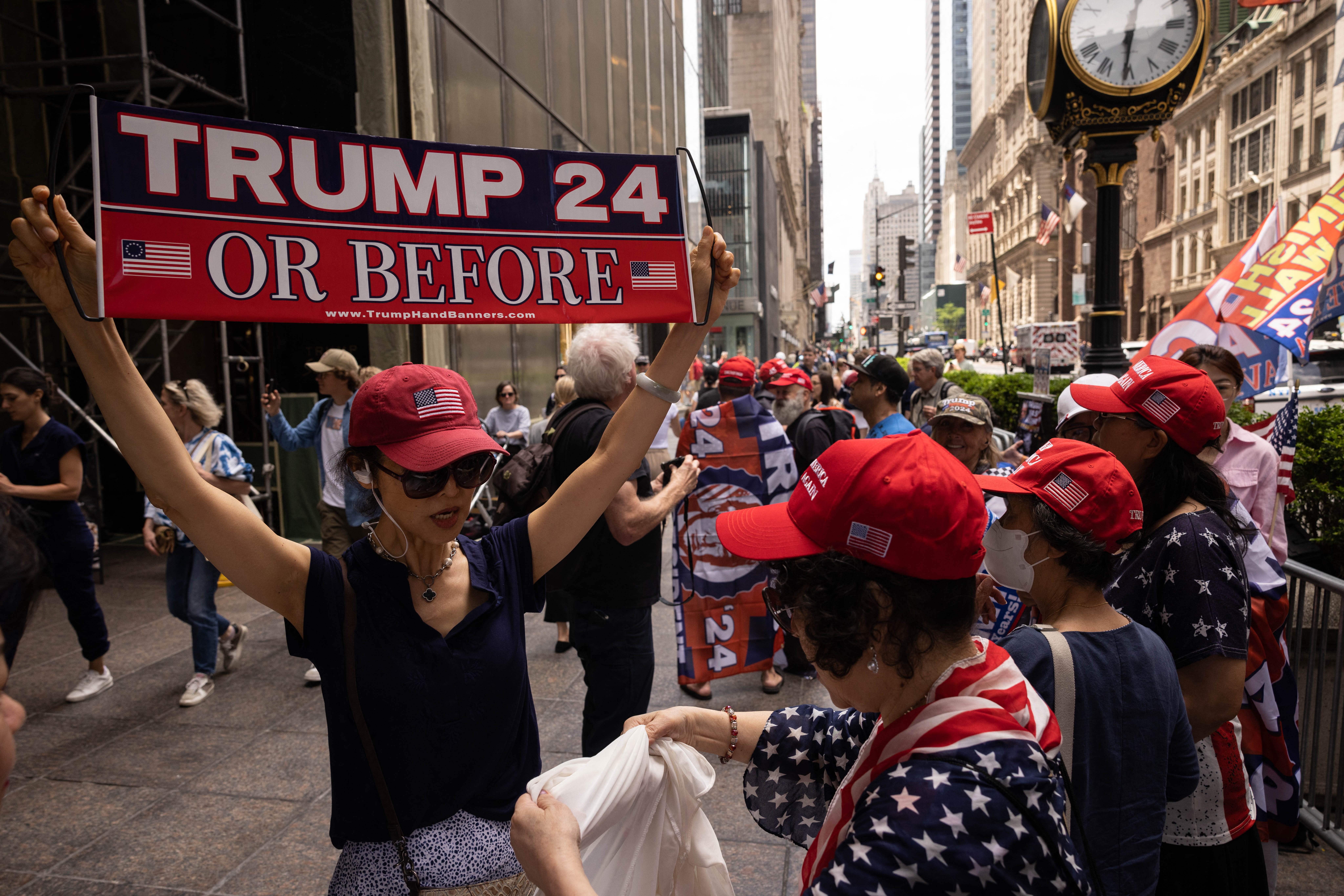 Supporters of former President Donald Trump gather outside of Trump Tower in New York City on June 13, 2023. The former president and 2024 presidential hopeful is appearing in court in Miami for an arraignment regarding 37 federal charges, including violations of the Espionage Act, making false statements, and conspiracy regarding his mishandling of classified material after leaving office.