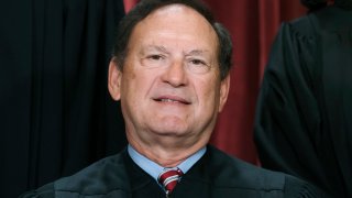 FILE - Associate Justice Samuel Alito joins other members of the Supreme Court