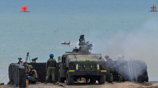 A soldier launches a US-made TOW A2 missile during a live firing exercise in Pingtung county on July 3, 2023.