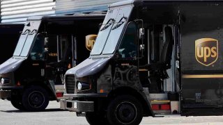 FILE- United Parcel Service trucks are seen parked at a distribution facility, June 30, 2023, in Boston.