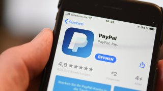 The PayPal application can be seen on a mobile phone.