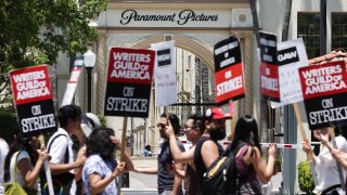 Striking Writers Guild of America workers picket outside Paramount Studios in Los Angeles, July 12, 2023.