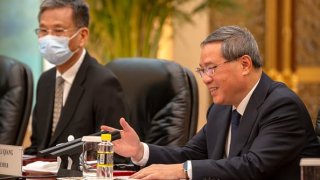 Chinese Premier Li Qiang, (R) speaks during a meeting with Asian Development Bank (ADB) President Masatsugu Asakawa (not pictured) at the Great Hall of the People on July 11, 2023, in Beijing, China.