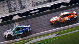 Chris Buescher, driver of the No. 17 Fifth Third Bank Ford, crosses the finish line ahead of Brad Keselowski, driver of the No. 6 King’s Hawaiian Ford, to win the NASCAR Cup Series Coke Zero Sugar 400 at Daytona International Speedway on Aug. 26, 2023 in Daytona Beach, Fla.