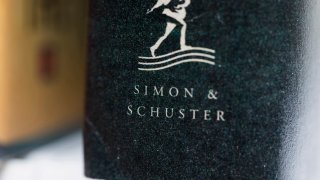 FILE - A book published by Simon & Schuster is displayed on July 30, 2022, in Tigard, Ore.