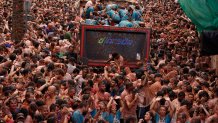 Revellers throw tomatoes at each other during the annual "Tomatina" tomato fight fiesta, in the village of Bunol near Valencia, Spain, Wednesday, Aug. 30, 2023.