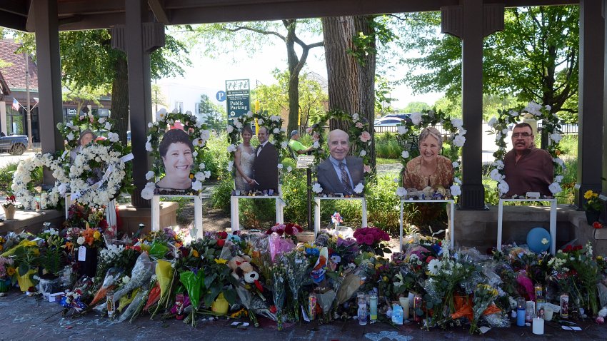 HIGHLAND PARK, ILLINOIS, USA – JULY 10: People lay flowers and cards near a spot where a mass shooting took place during the 4th of July parade in Highland Park, Illinois on July 10, 2022. (Photo by Jacek Boczarski/Anadolu Agency via Getty Images)