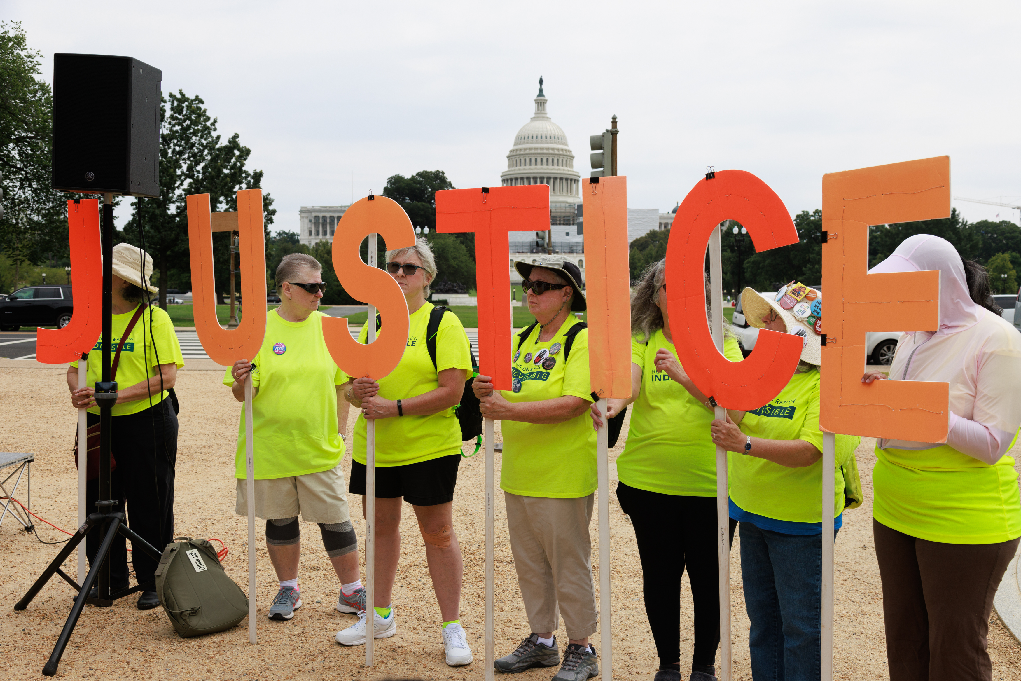 WASHINGTON D.C., UNITED STATES – AUGUST 3: People gather for the ‘Not Above the Law’ protest on the National Mall ahead of former US President Donald Trump’s arrival for court appearance in Washington DC, United States on August 3, 2023. Former US President Donald Trump was indicated for arraignment on conspiracy and obstruction federal charges related to the January 6, 2021 US Capitol riots. (Photo by Bryan Dozier/Anadolu Agency via Getty Images)