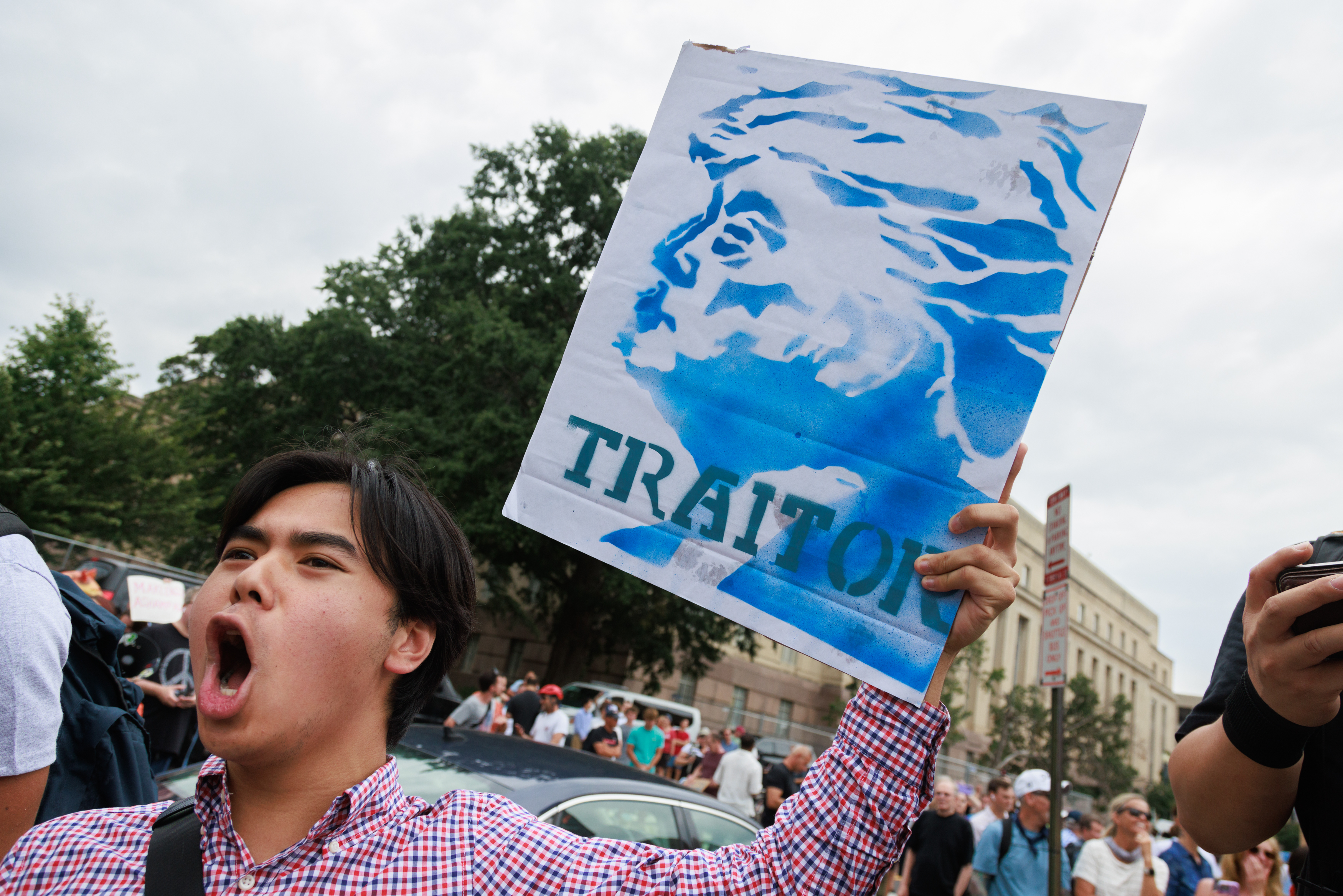 âââââââWASHINGTON DC, UNITED STATES – AUGUST 03: An anti-Trump demonstrator yells at Trump supporters gathered outside of the Elijah Barrett Prettyman Federal Courthouse in Washington, D.C., on August 3, 2023 ahead of former U.S. President Donald Trump’s arrival for arraignment on conspiracy and obstruction federal charges related to the January 6, 2021 U.S. Capitol riots. (Photo by Bryan Dozier/Anadolu Agency via Getty Images)