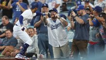 LOS ANGELES, CALIFORNIA - AUGUST 02: Mookie Betts #50 of the Los Angeles Dodgers celebrates with fans after hitting a solo home run against the Oakland Athletics during the second inning of a game at Dodger Stadium on August 02, 2023 in Los Angeles, California. (Photo by Michael Owens/Getty Images)