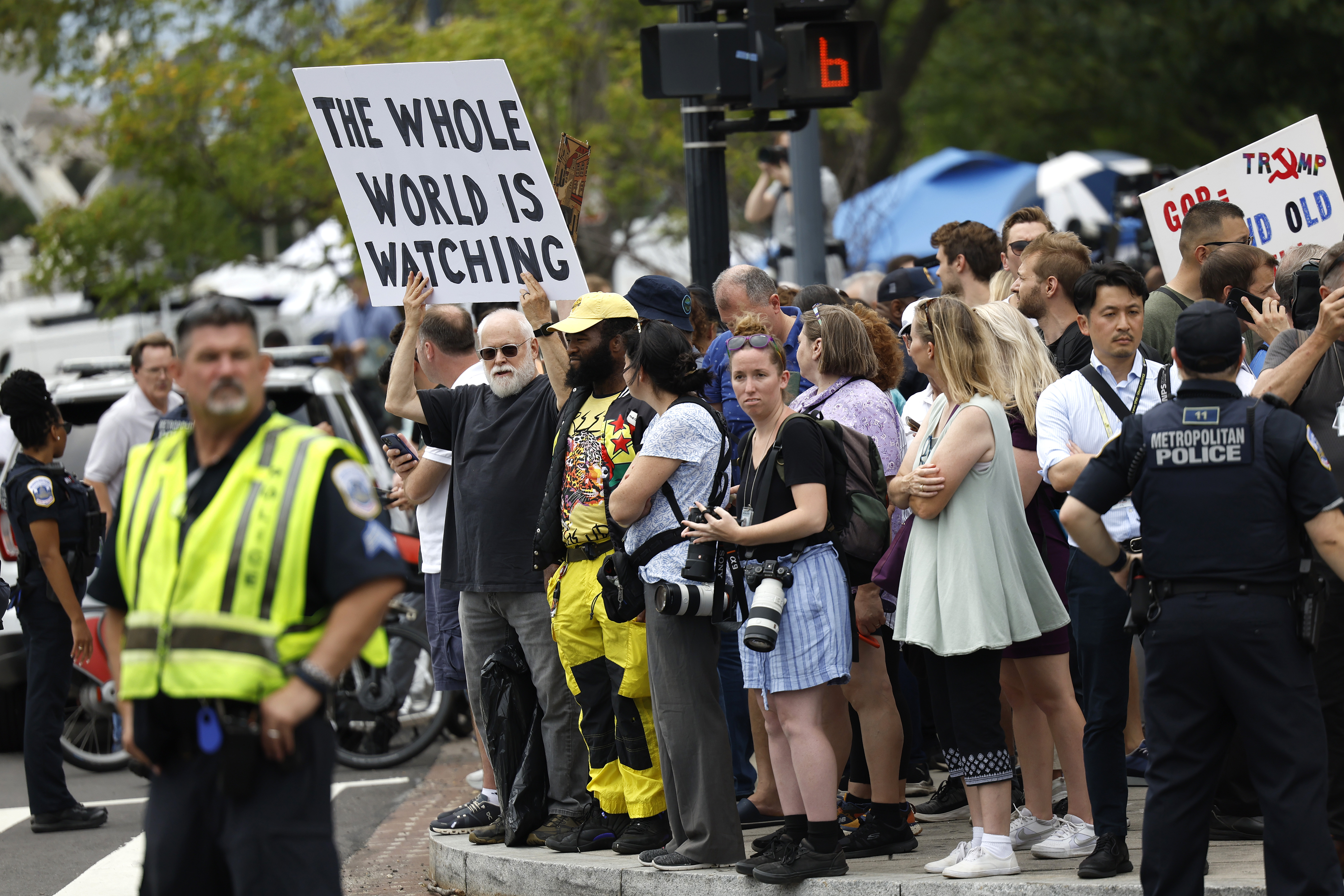 WASHINGTON, DC – AUGUST 03: People gather outside of the E. Barrett Prettyman United States Courthouse as they await the arrival of former U.S. President Donald Trump on August 03, 2023 in Washington, DC. Former U.S. President Donald Trump is scheduled to be arraigned this afternoon after being indicted on four felony counts for his alleged efforts to overturn the 2020 election. (Photo by Anna Moneymaker/Getty Images)