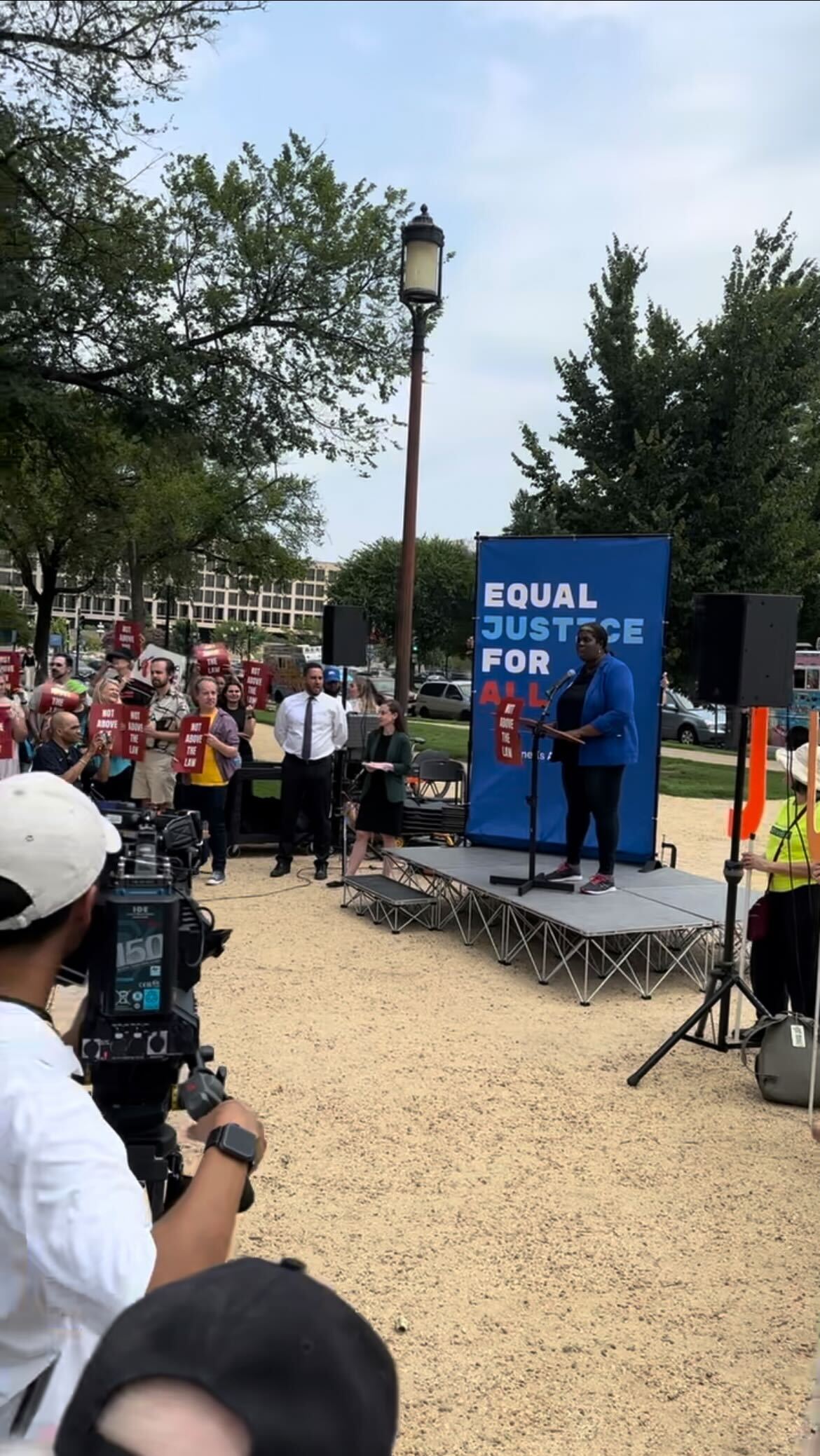 Anti-Trump activists rally on the National Mall near the National Portrait Gallery at noon on Aug. 3, 2023.
