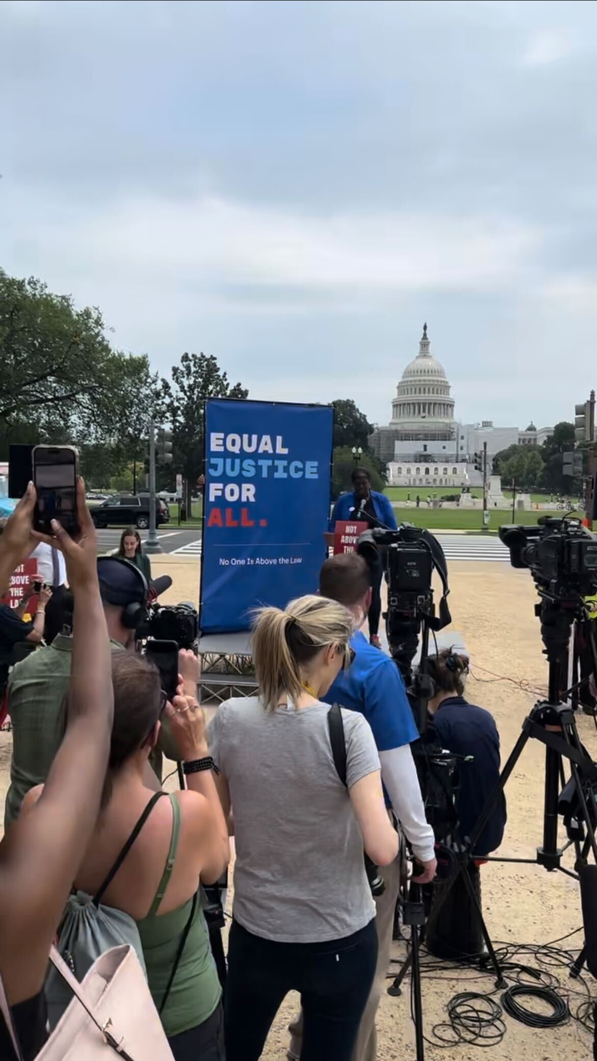 Anti-Trump activists rally on the National Mall near the National Portrait Gallery at noon on Aug. 3, 2023.